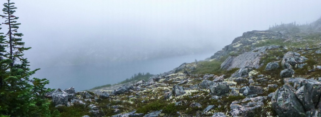 Fog sits over a lake on the Chilkoot Trail