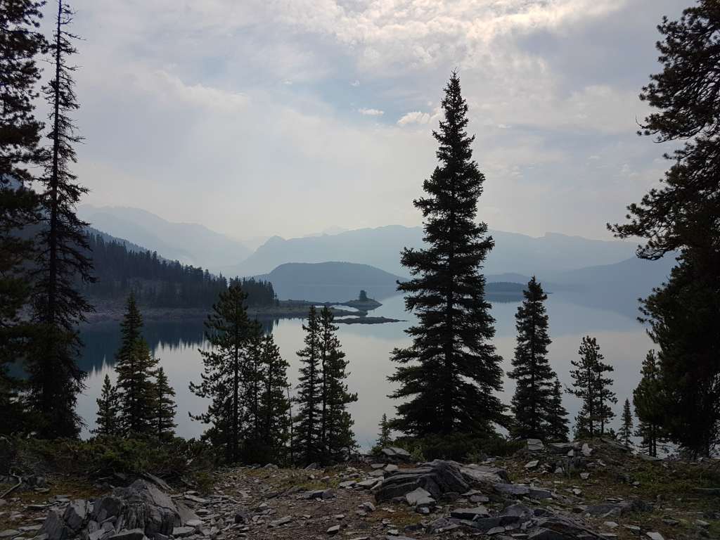 Upper Kananaskis Lake with trees in the foreground