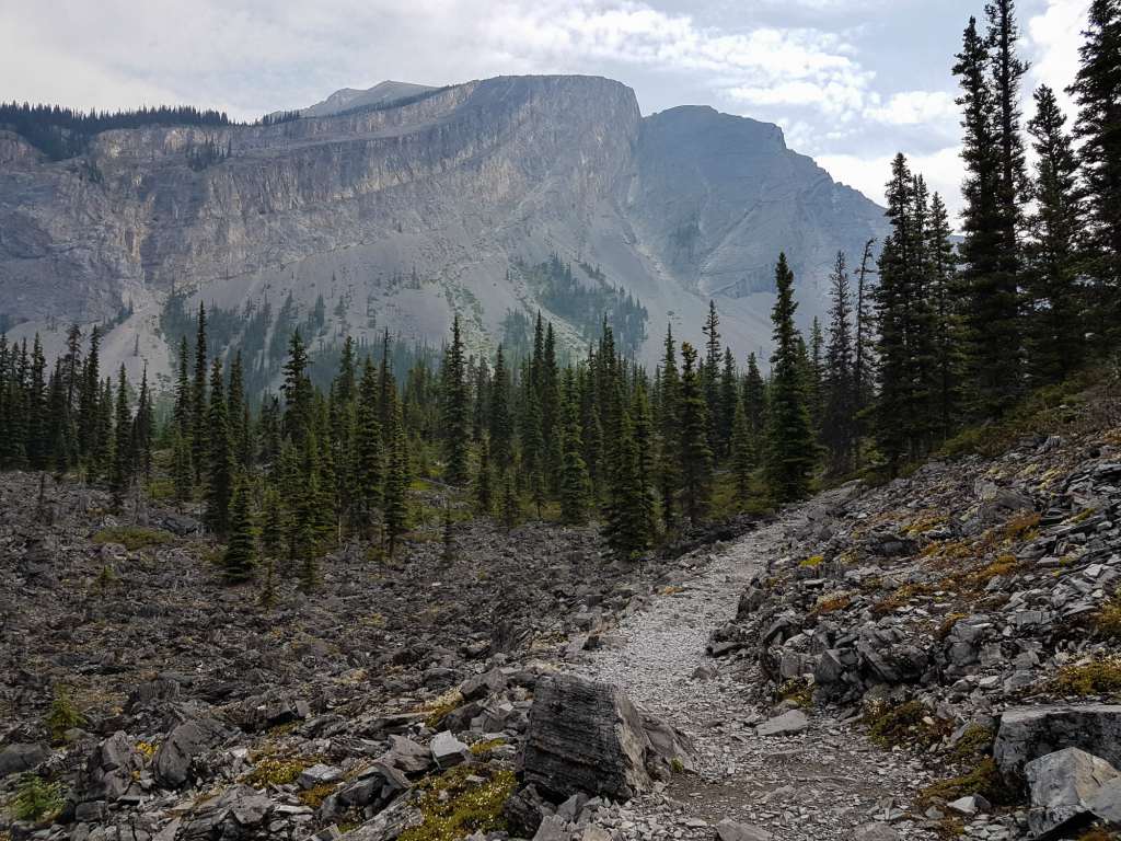 A trail winds through mountains