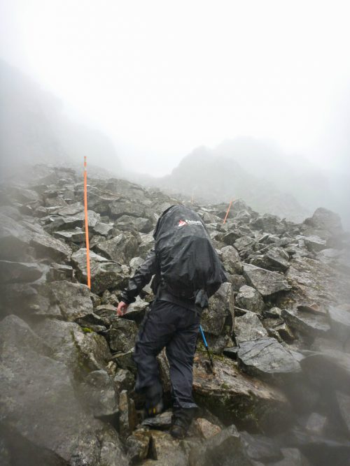 A man climbs the Golden Stairs on the Chilkoot Trail