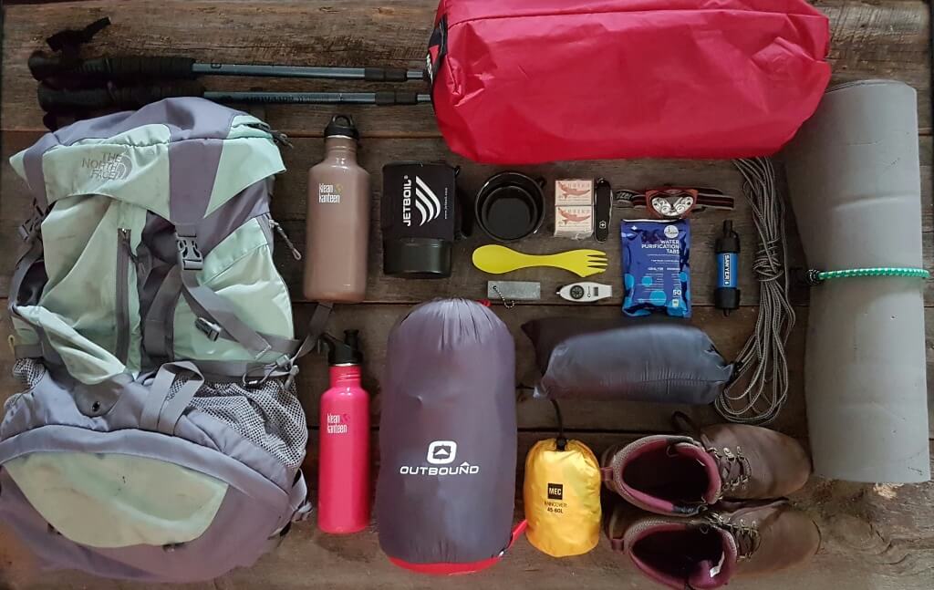 Backpacking gear is laid out neatly prior to packing