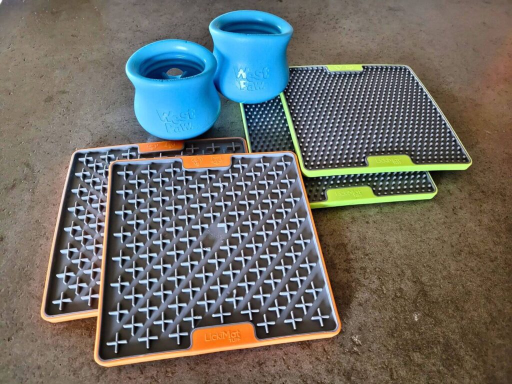 A variety of canine enrichment feeders including toppls and lick mats
