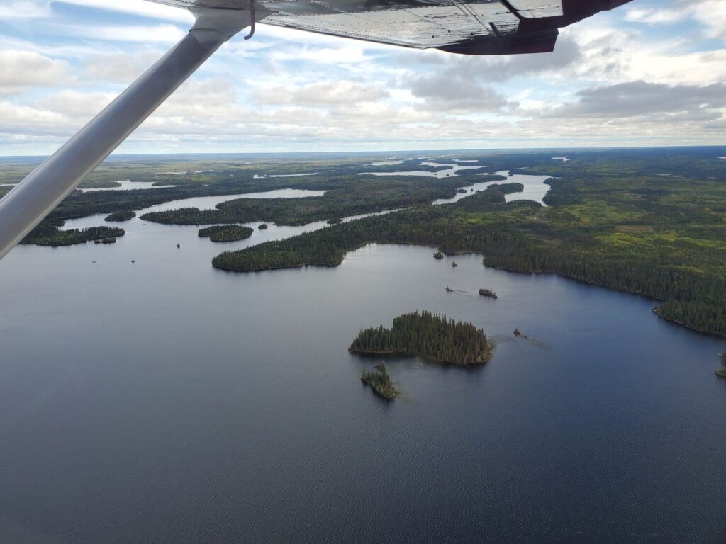 Looking out over lakes and forests from a floatplane
